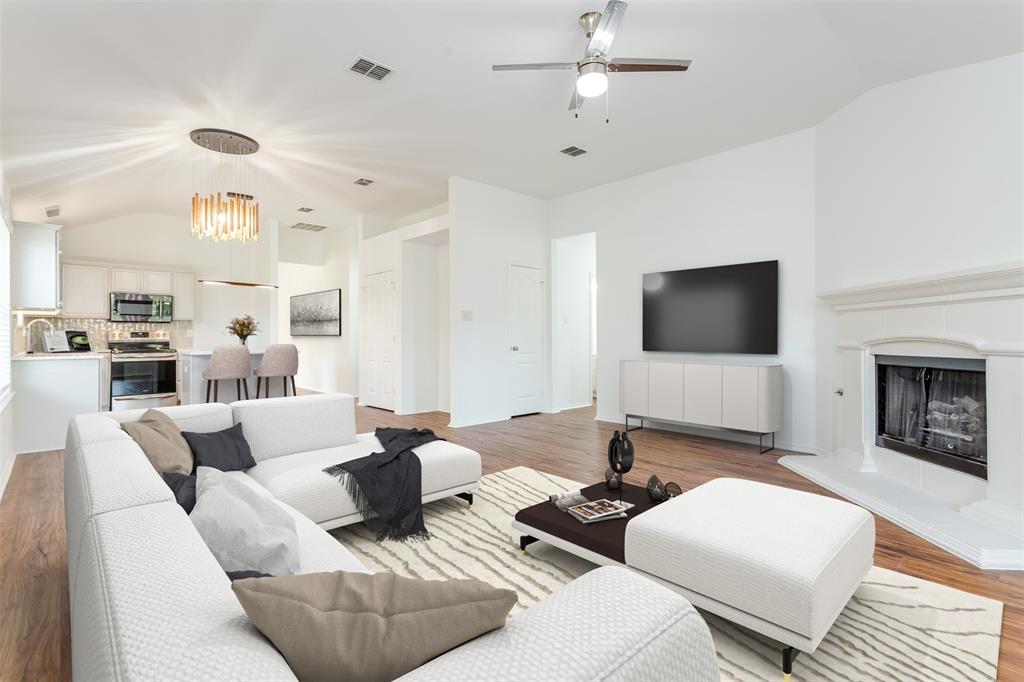 a living room with furniture flat screen tv and a fireplace