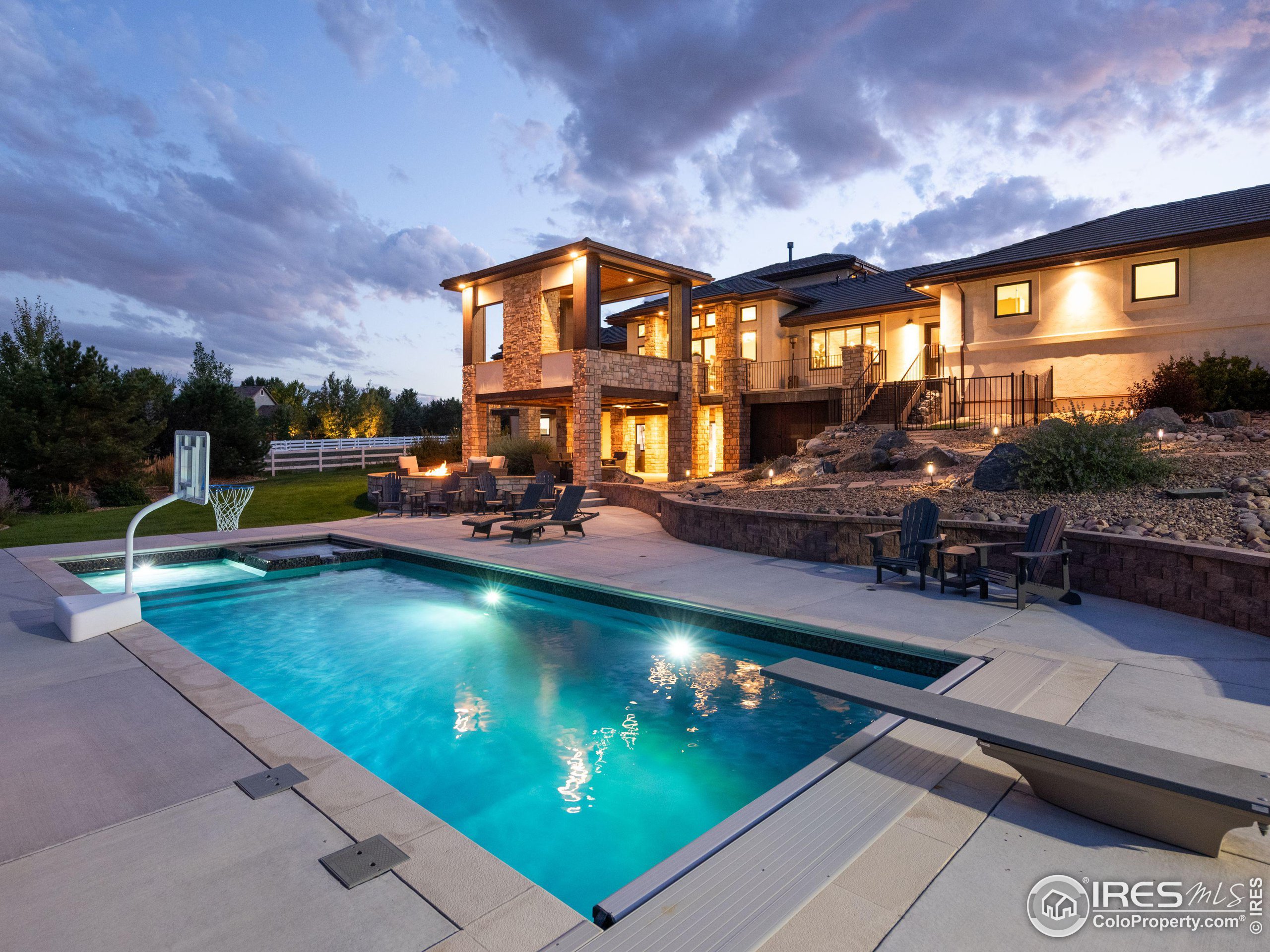 a view of a swimming pool with outdoor seating