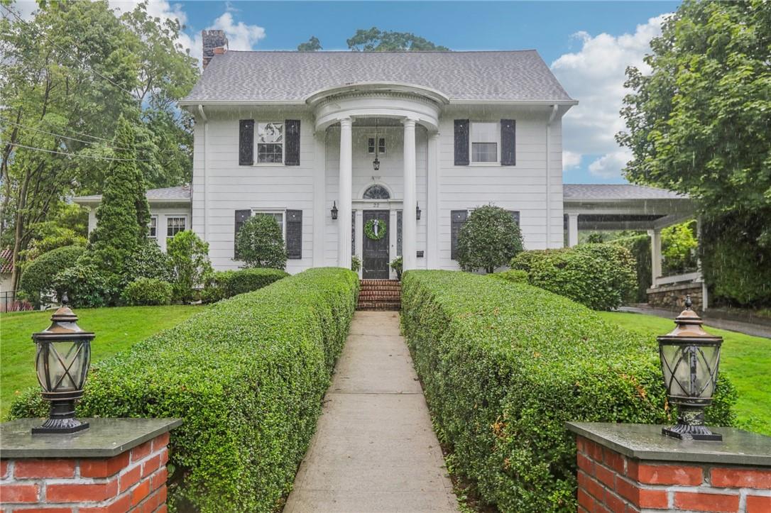 a front view of a house with a yard