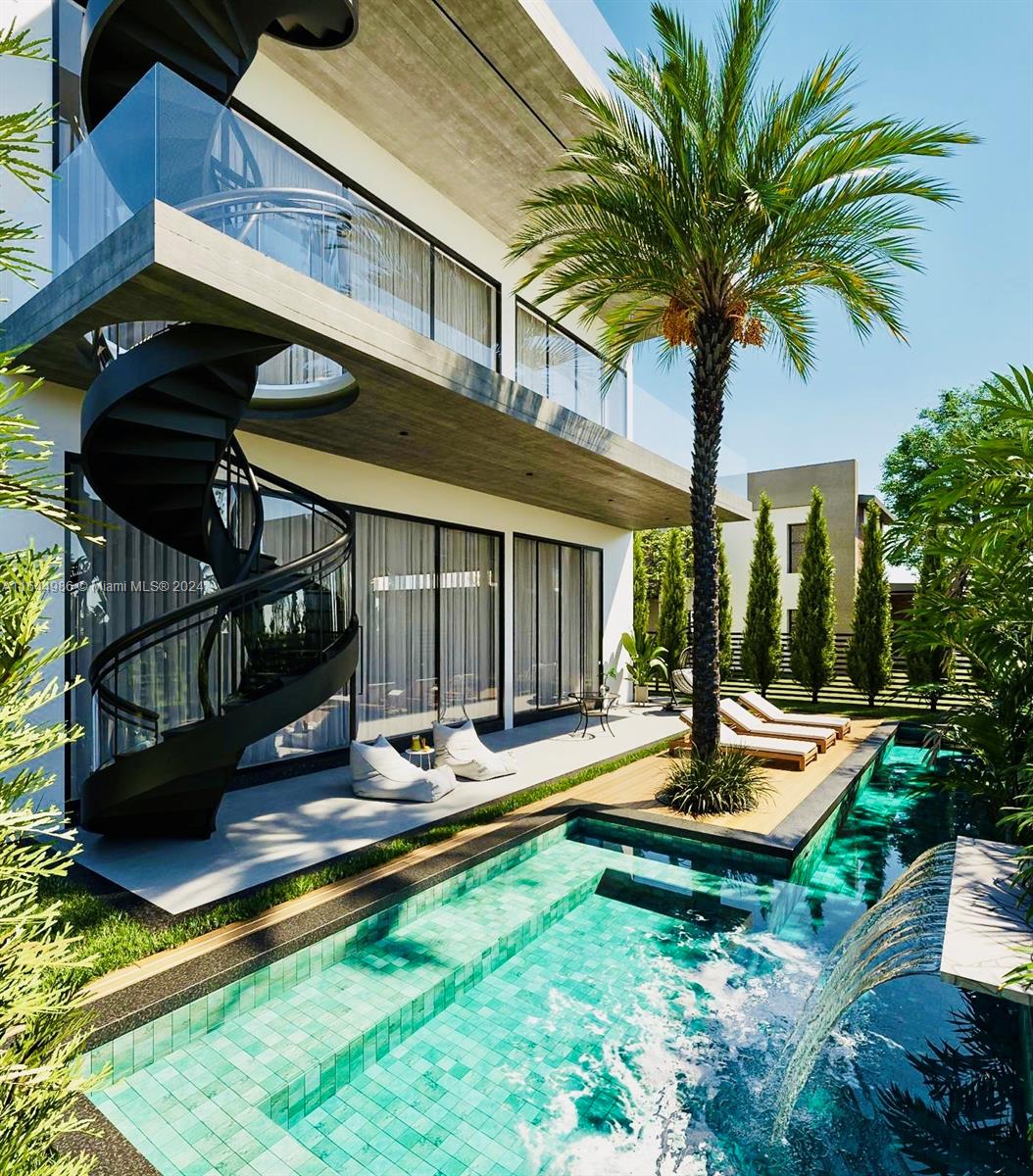 a view of a house with pool and sitting area