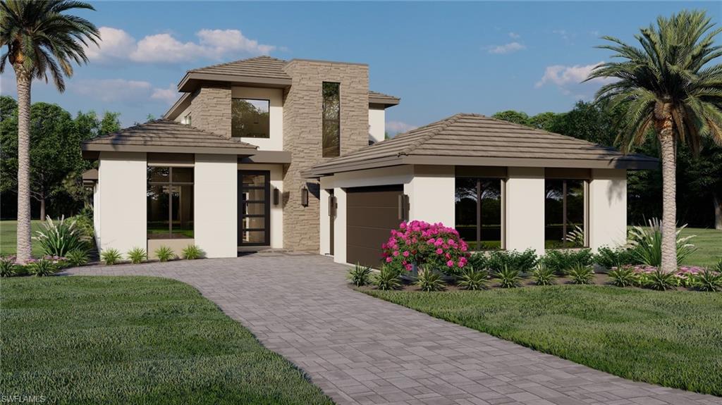 Prairie-style home featuring a garage and a front yard