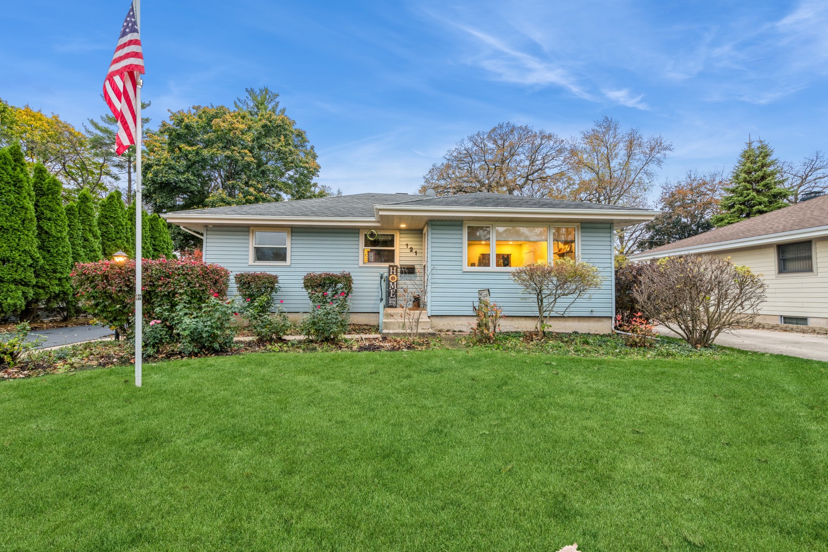 a front view of house with yard and outdoor seating