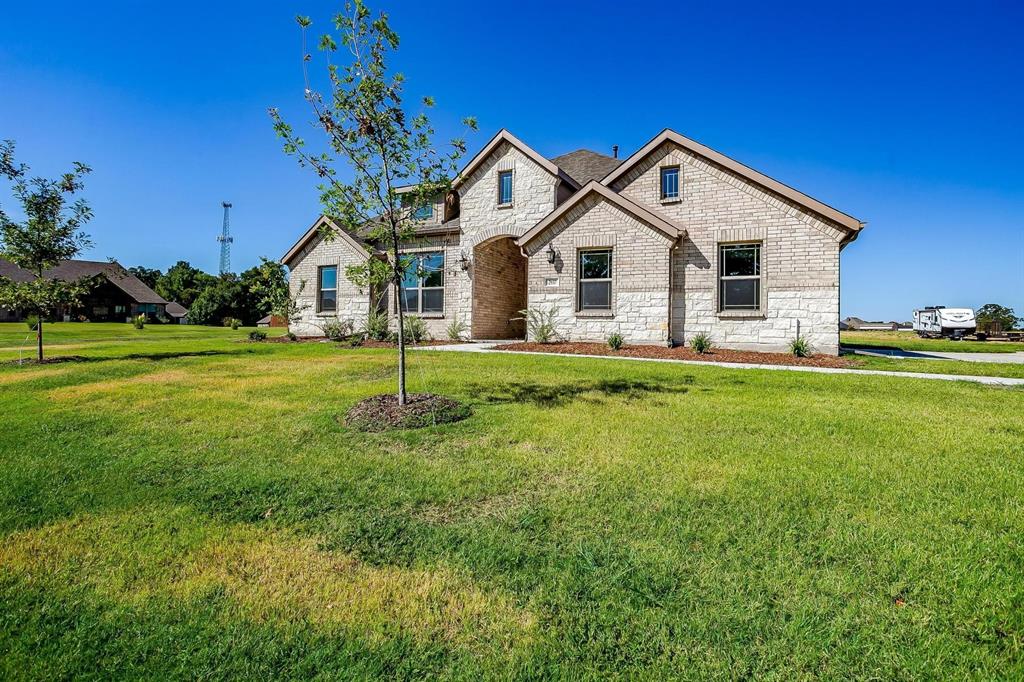 a front view of a house with a yard