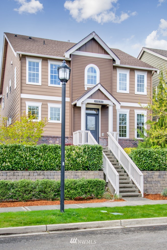 a front view of a house with a yard