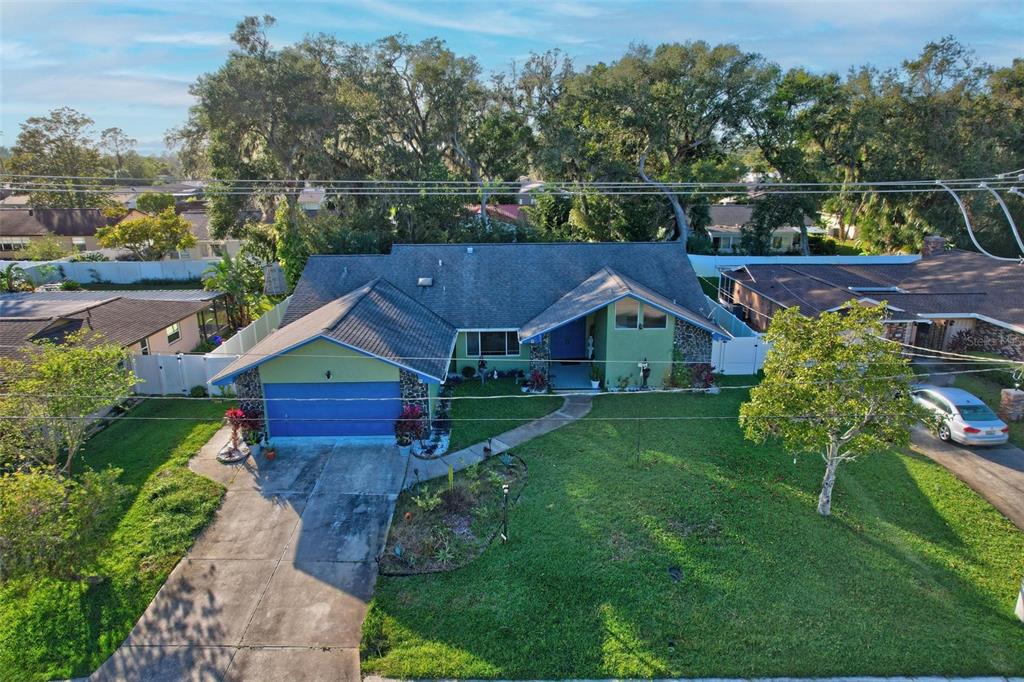 aerial view of a house with a big yard