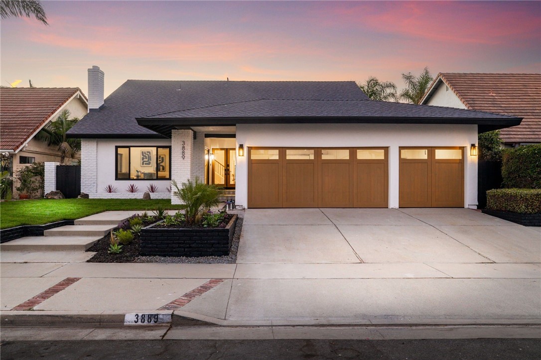 a front view of a house with garage