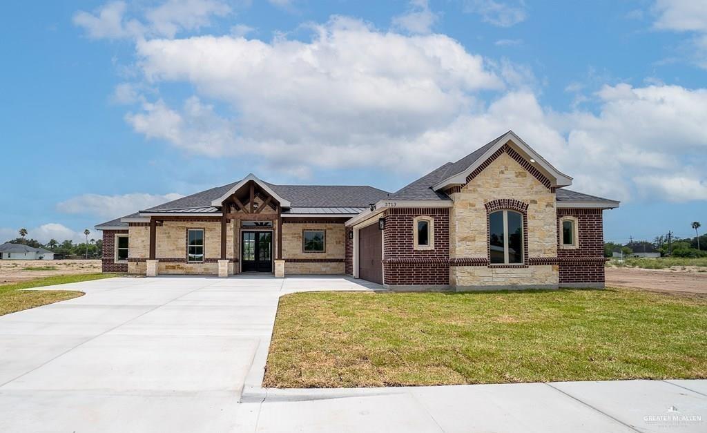 View of front of property with a front lawn