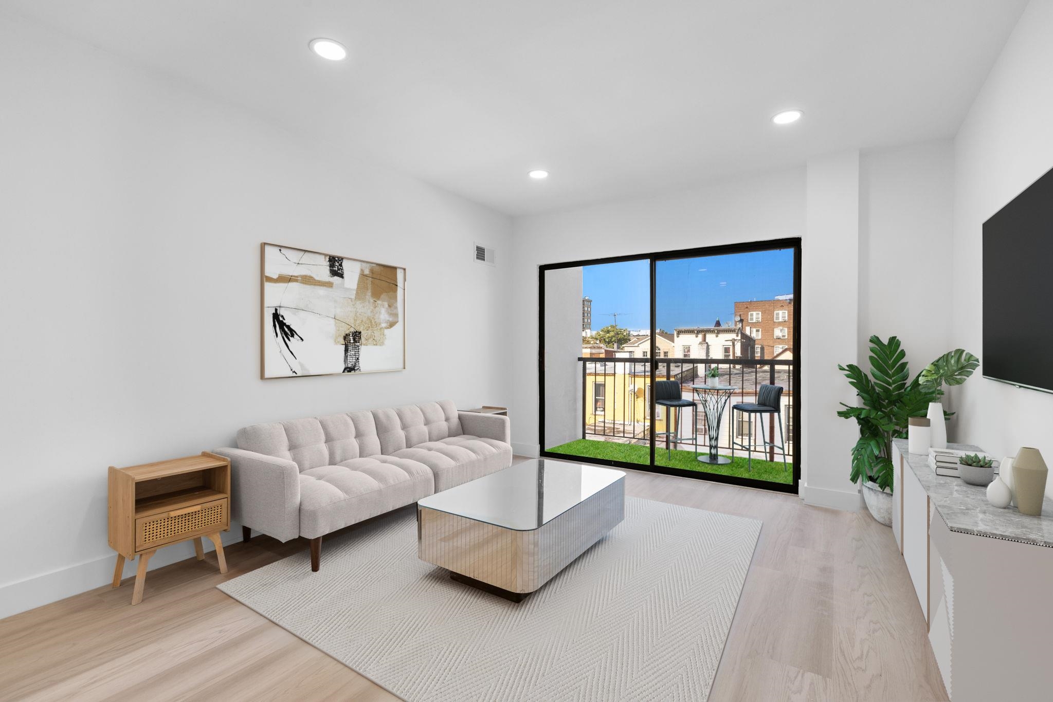 a living room with furniture and a large window