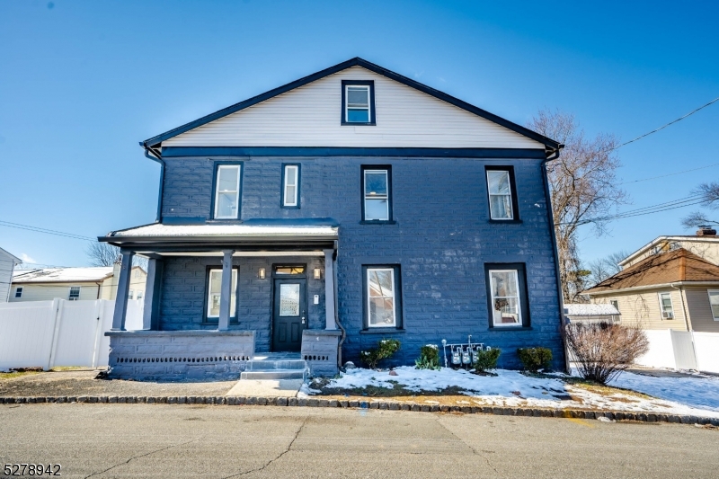 a front view of a house with yard