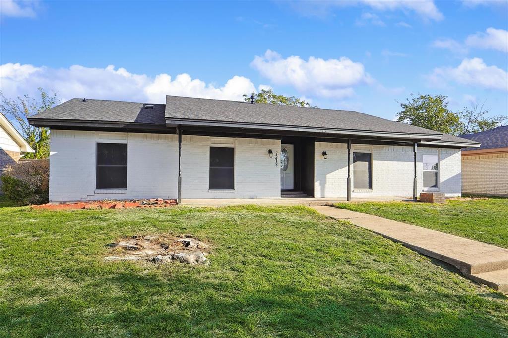 front view of a house with a yard