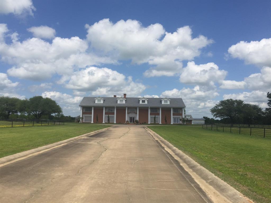 a view of a house with a big yard