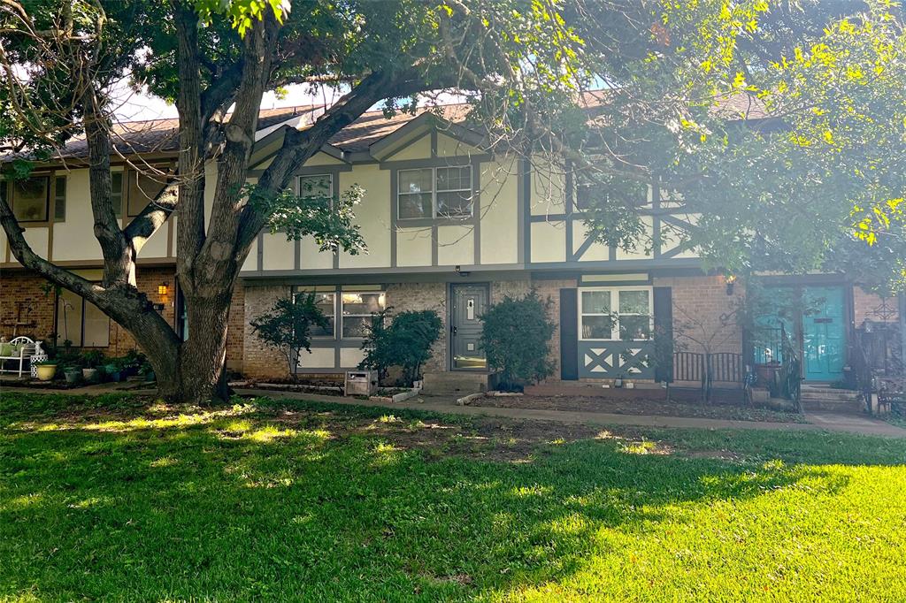 a view of a house with swimming pool and garden