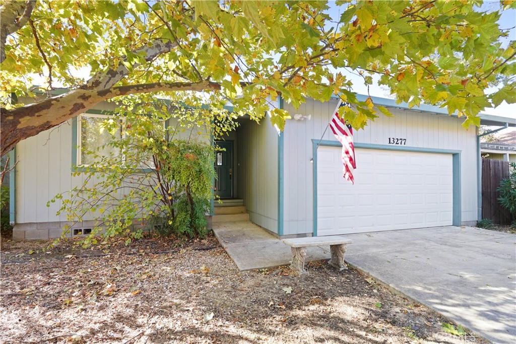 a view of a house with a tree