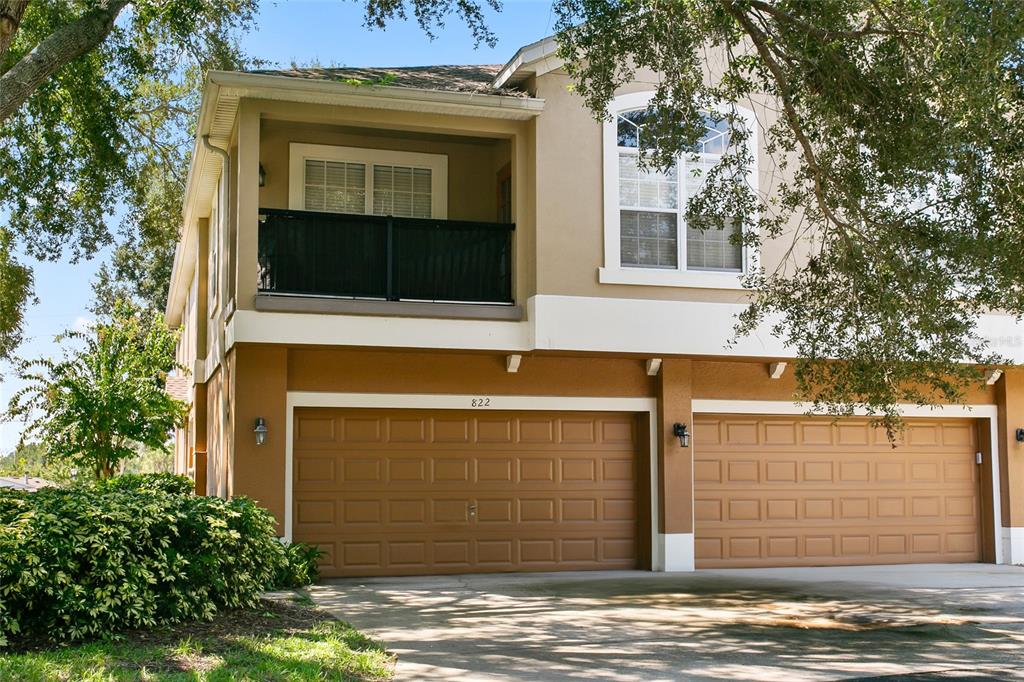 a front view of a house with a garage