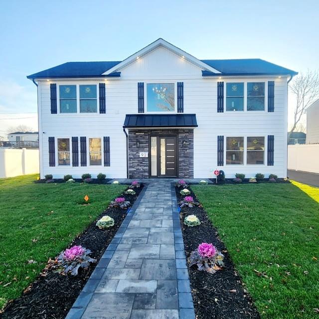 a front view of a house with garden