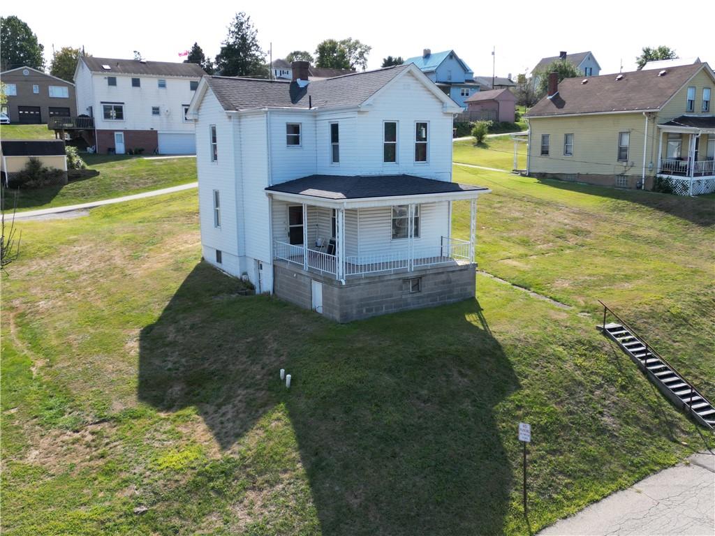 a view of a big house with a big yard