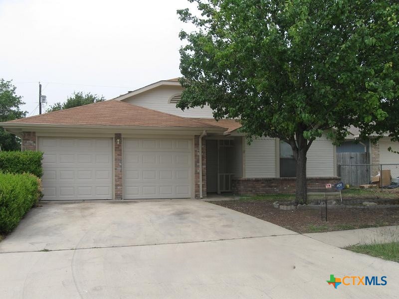 front view of a house with yard