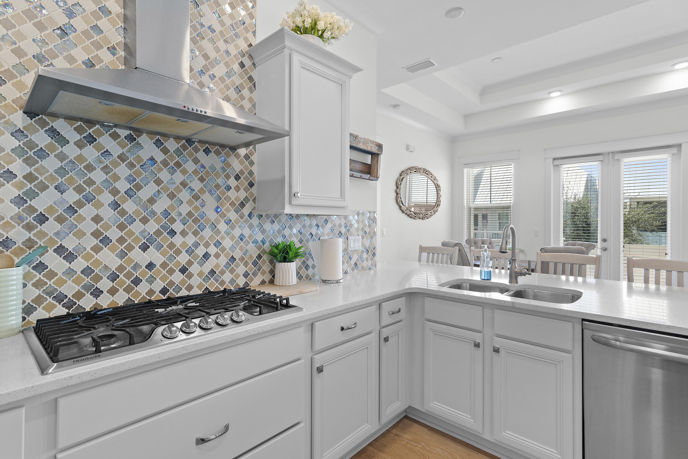 a kitchen with a sink stove and cabinets