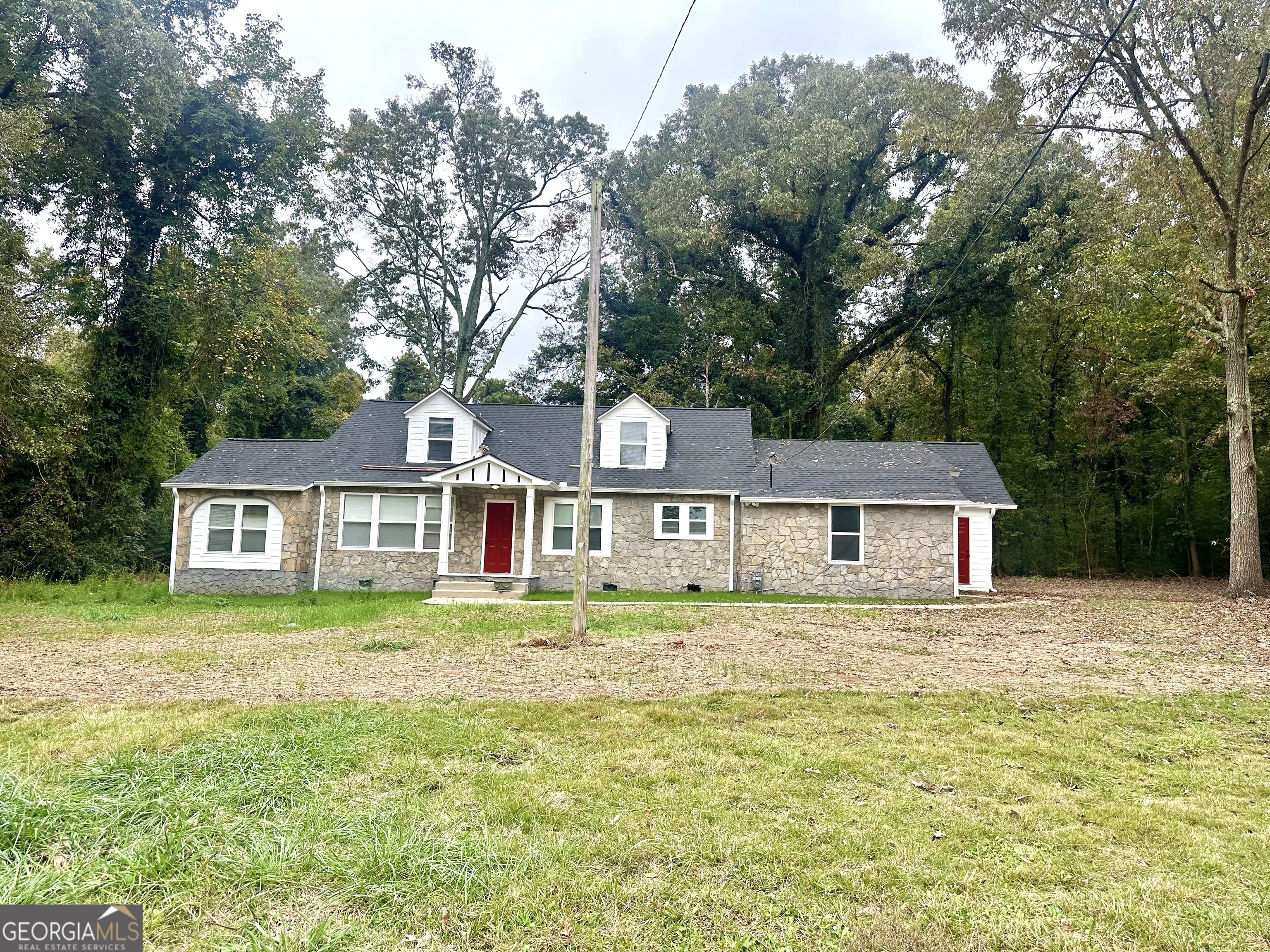 front view of a house with a yard