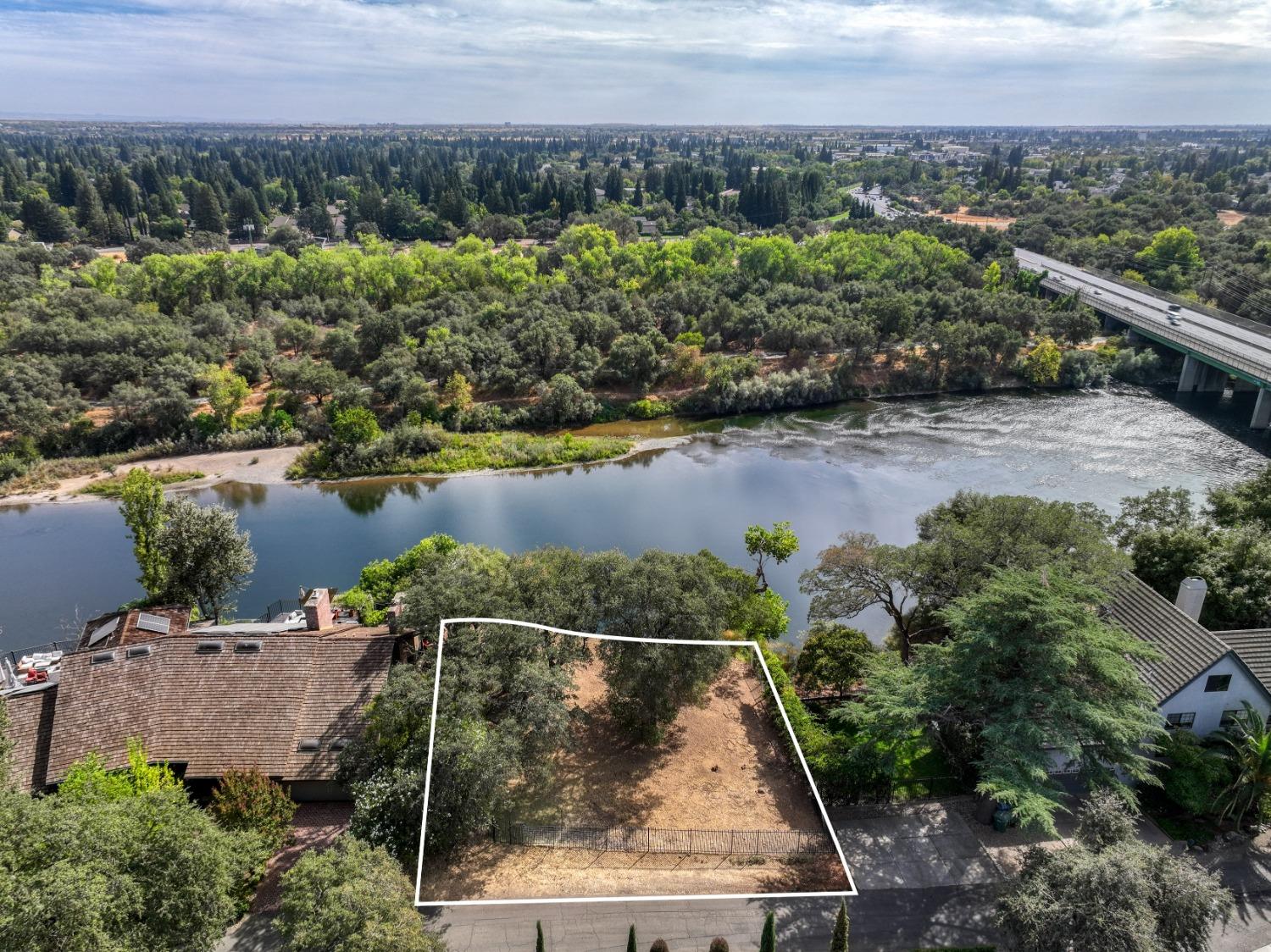 an aerial view of a house with a lake view