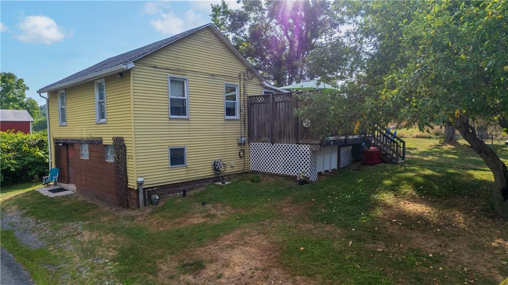 a view of backyard with a garden and entertaining space