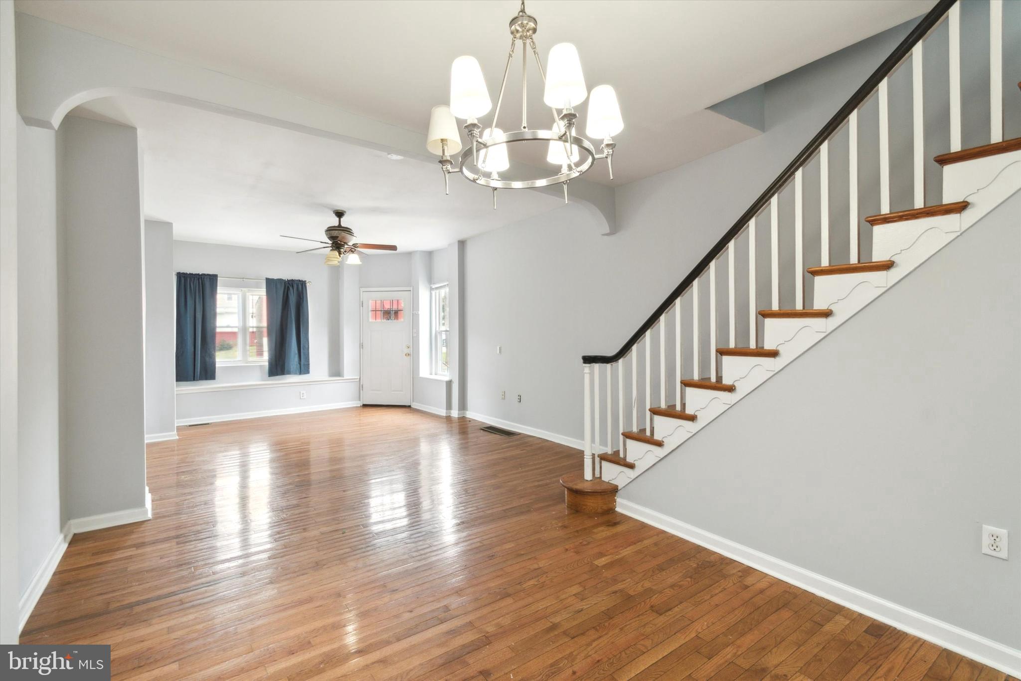 a view of an entryway and wooden floor