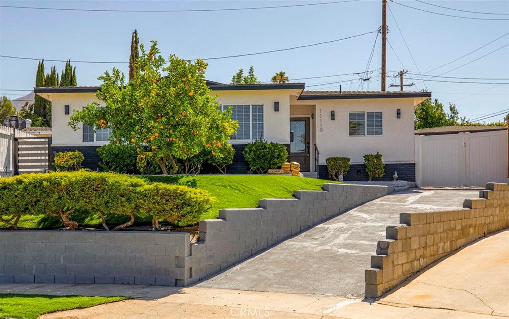 a view of a house with a garden