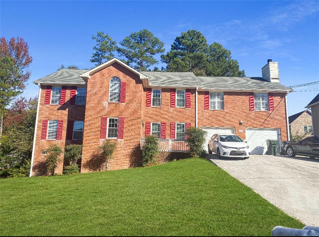 a front view of a house with a yard