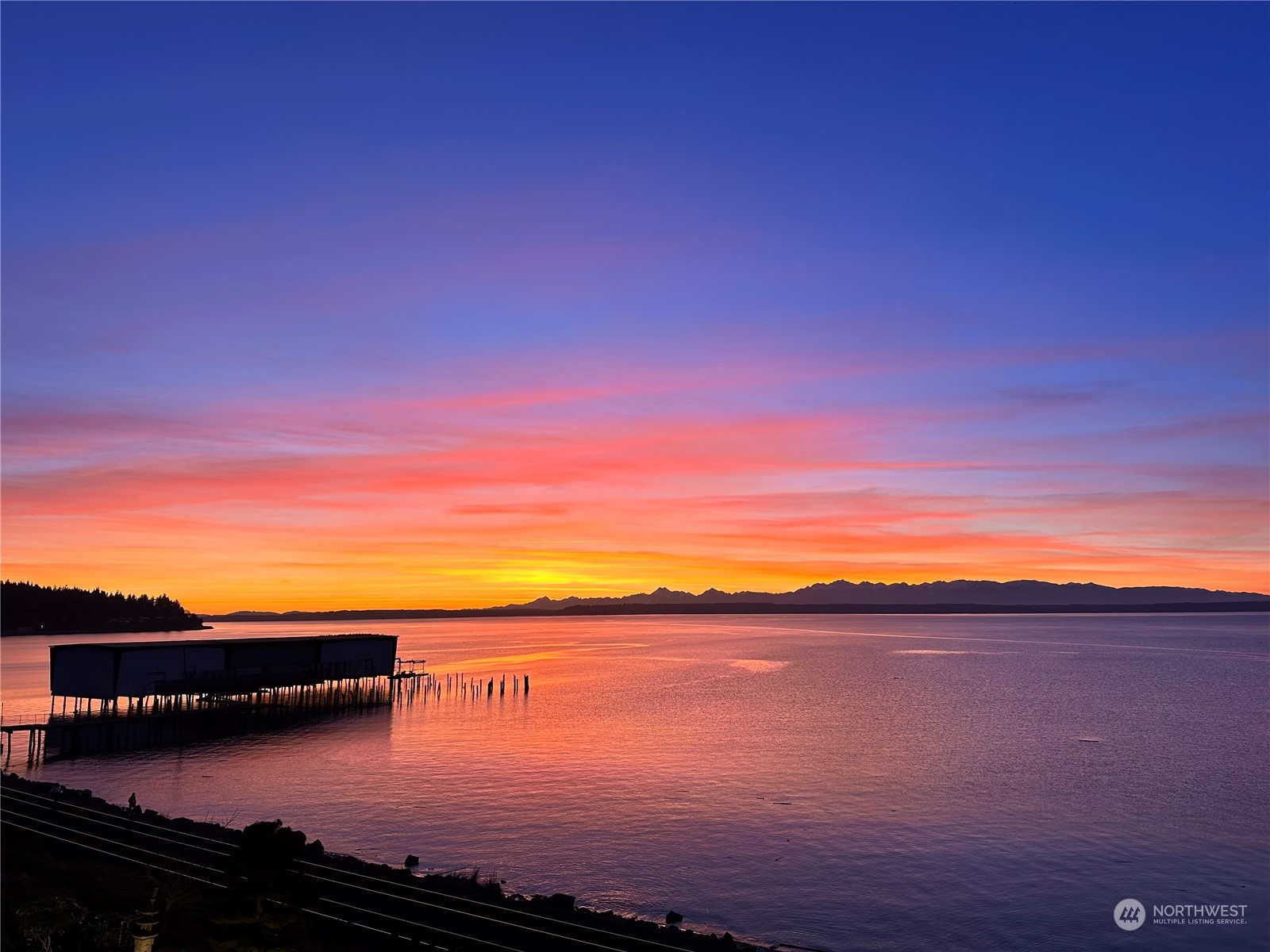 a view of lake with sunset