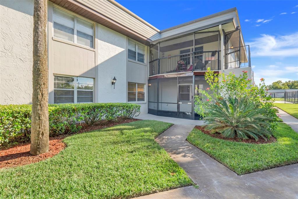 First flr unit with spacious covered screened patio with new screen and freshly painted close to serene pond with fountain.