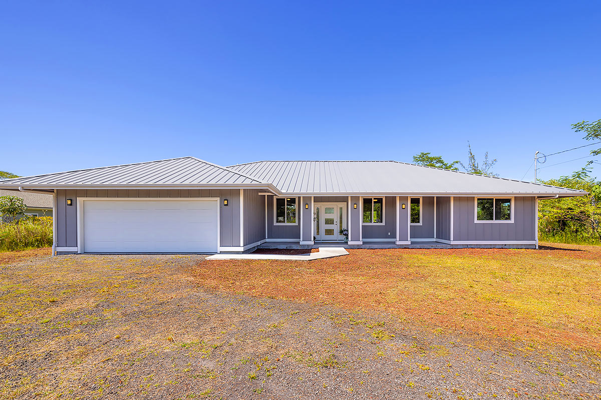 a front view of a house with yard