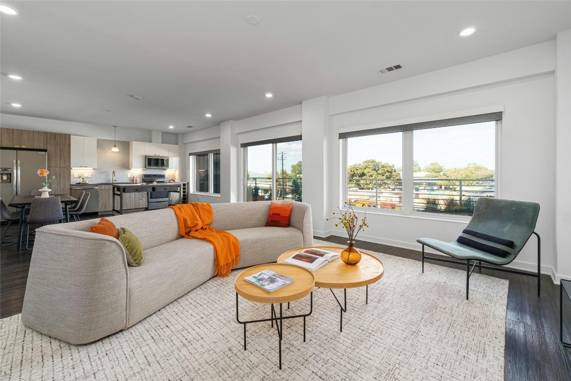 Living room with large windows to patio.