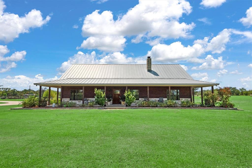 front view of a house with a yard