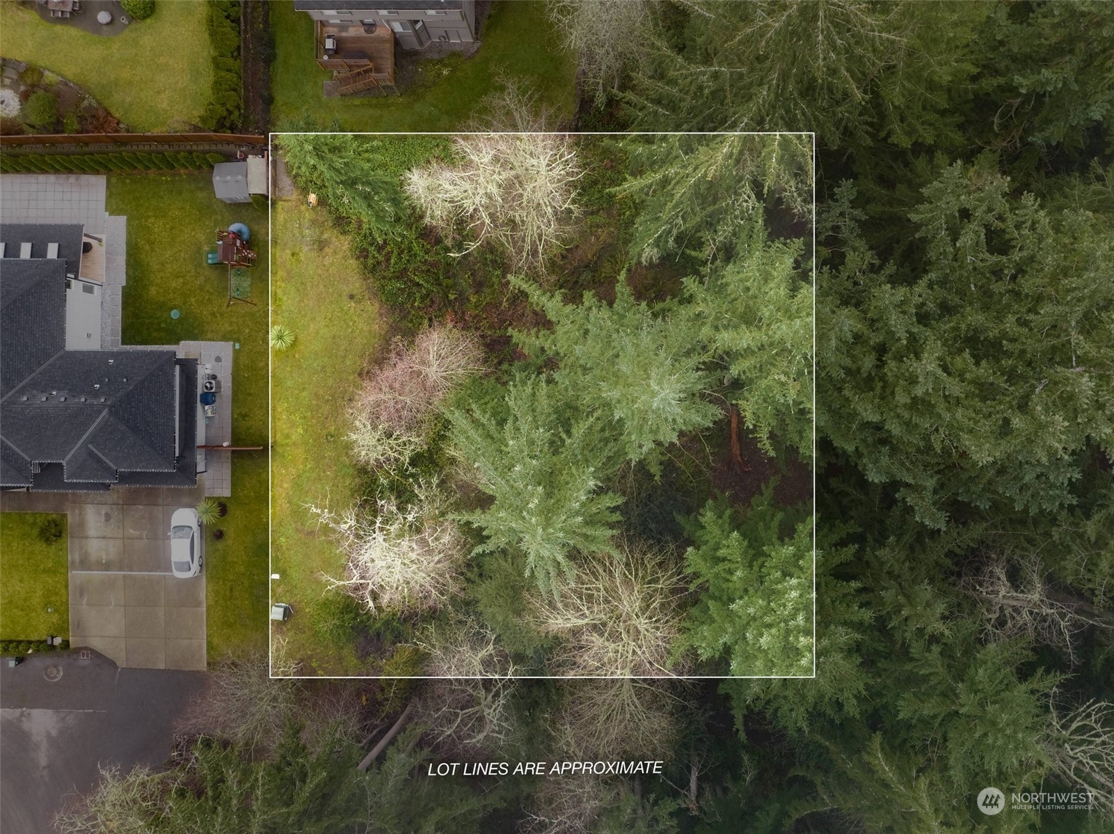 an aerial view of residential house with outdoor space