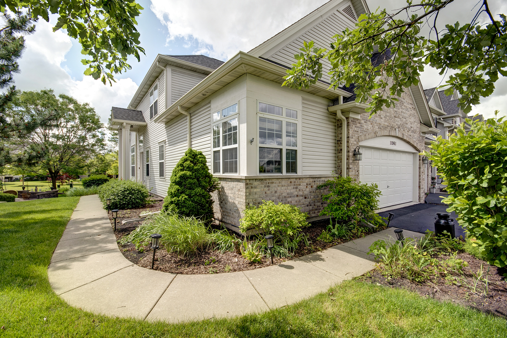 a front view of a house with a yard