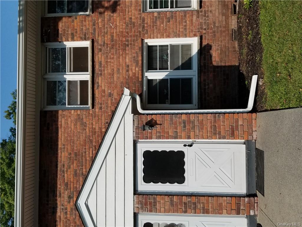 a front view of a house with a garage