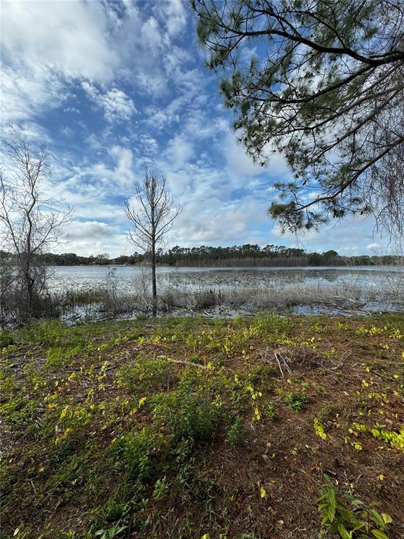 a view of a lake with a big yard