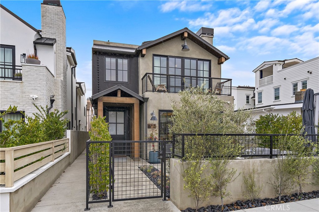 a front view of a house with a fence