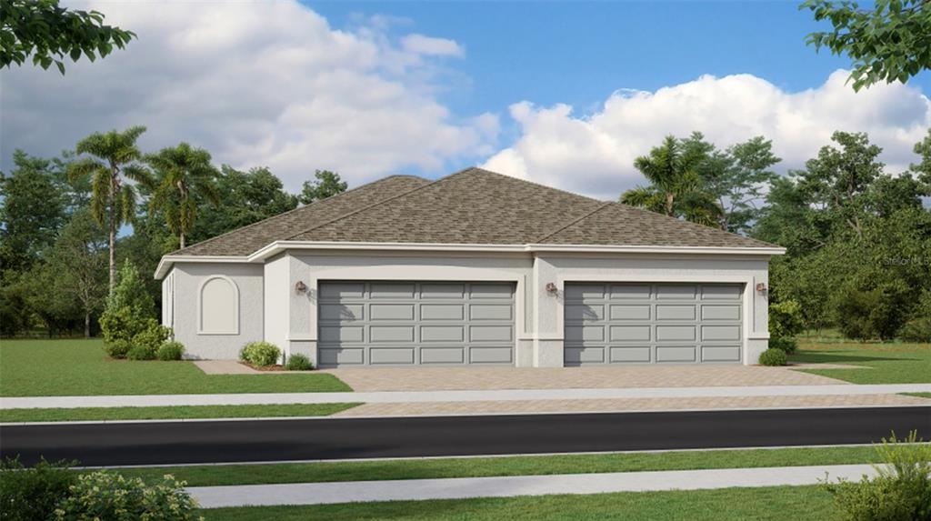 a front view of a house with a garden and garage