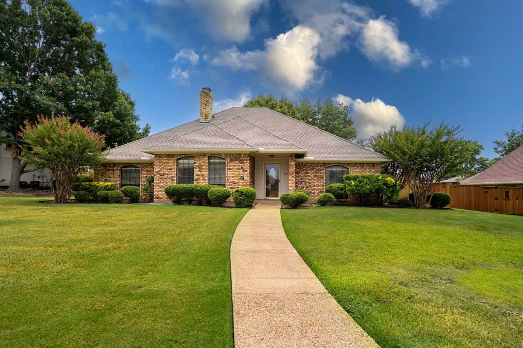 a front view of a house with yard