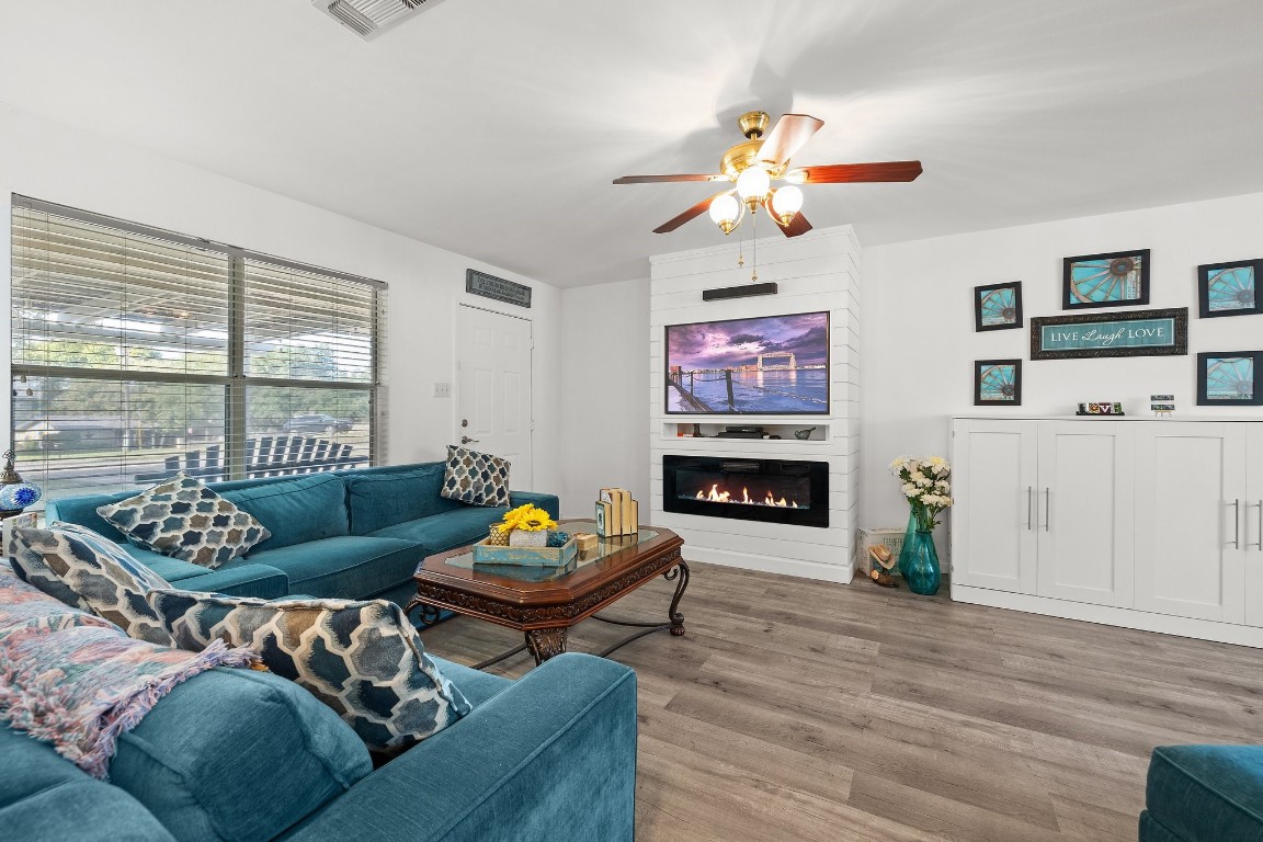 a living room with furniture and a fireplace