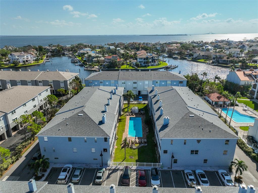 an aerial view of a house with a swimming pool yard and outdoor seating