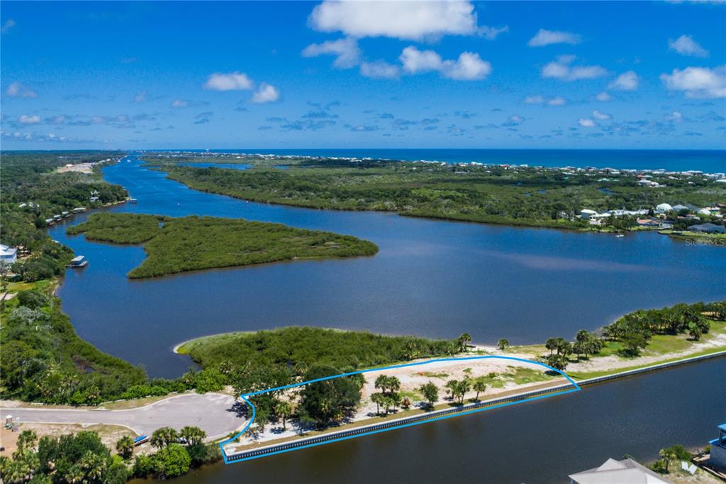 an aerial view of a house with a lake view