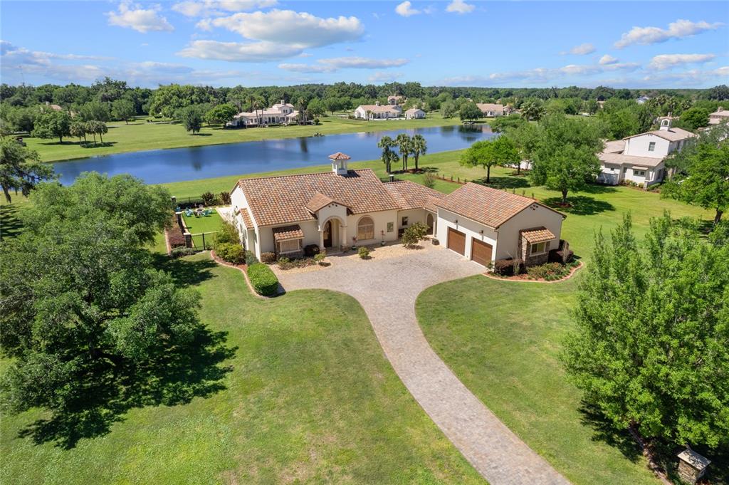 an aerial view of a house with garden space and outdoor space