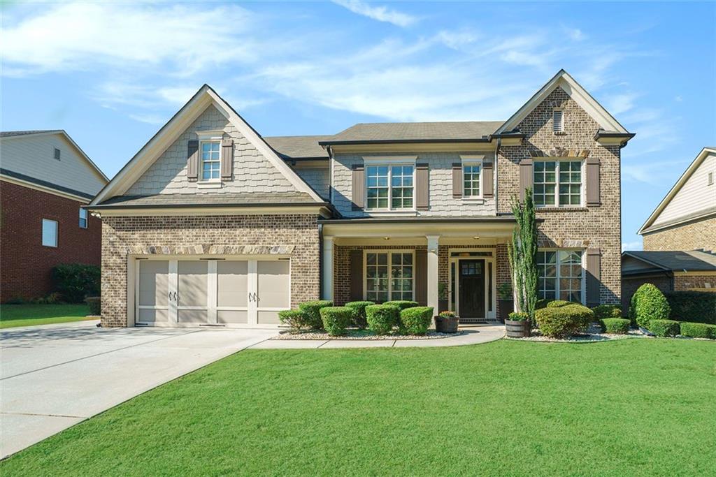 front view of a house with a yard