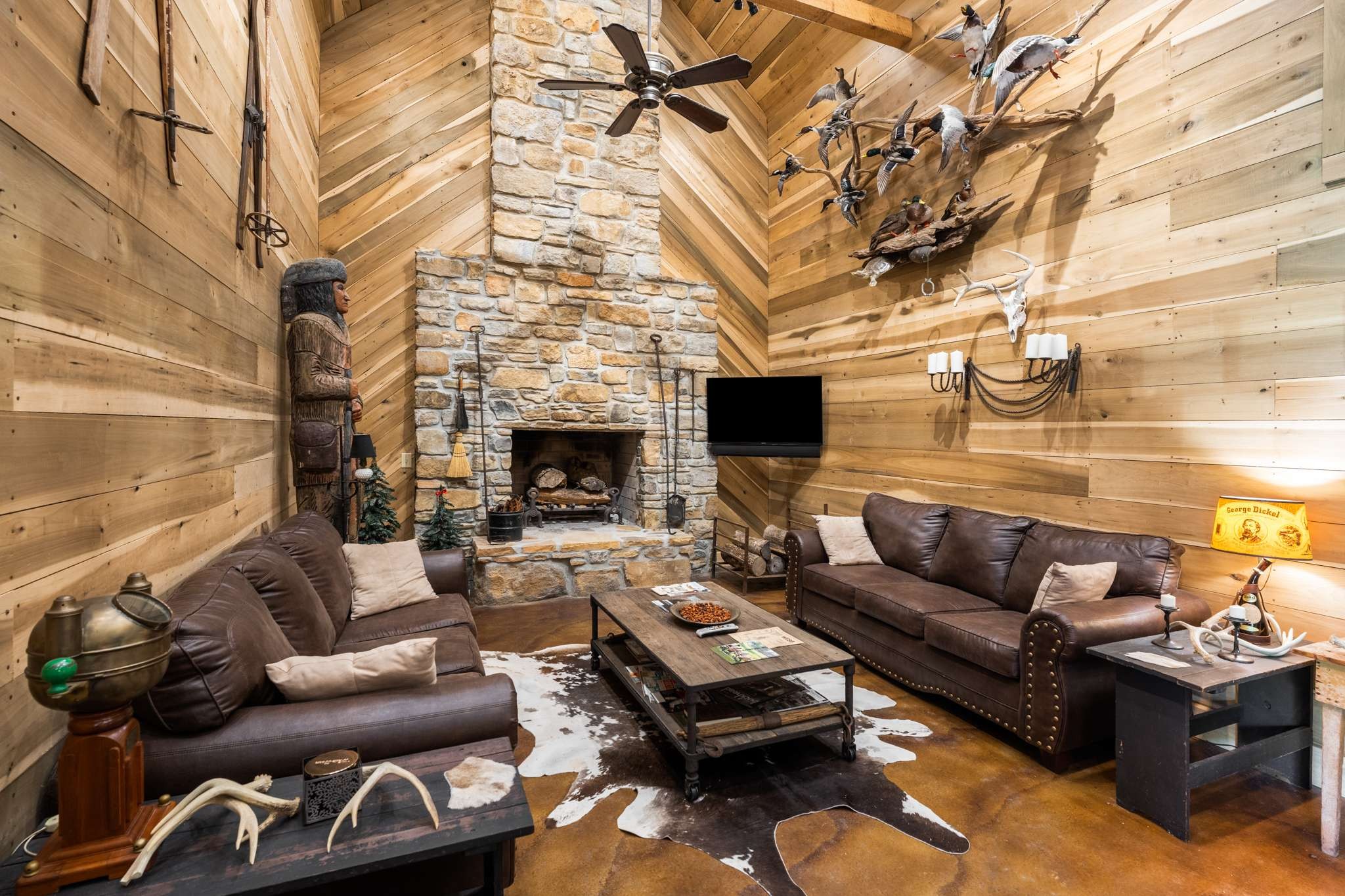 a living room with furniture a fireplace and a rug