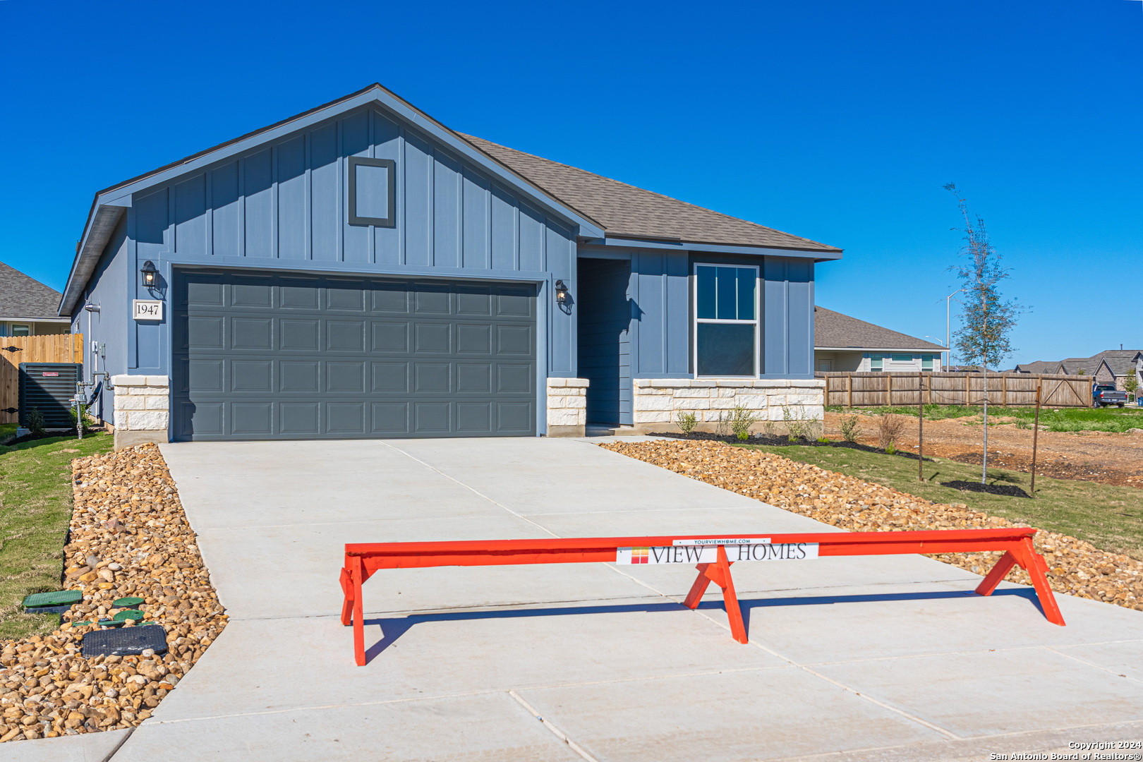 a front view of a house with garage