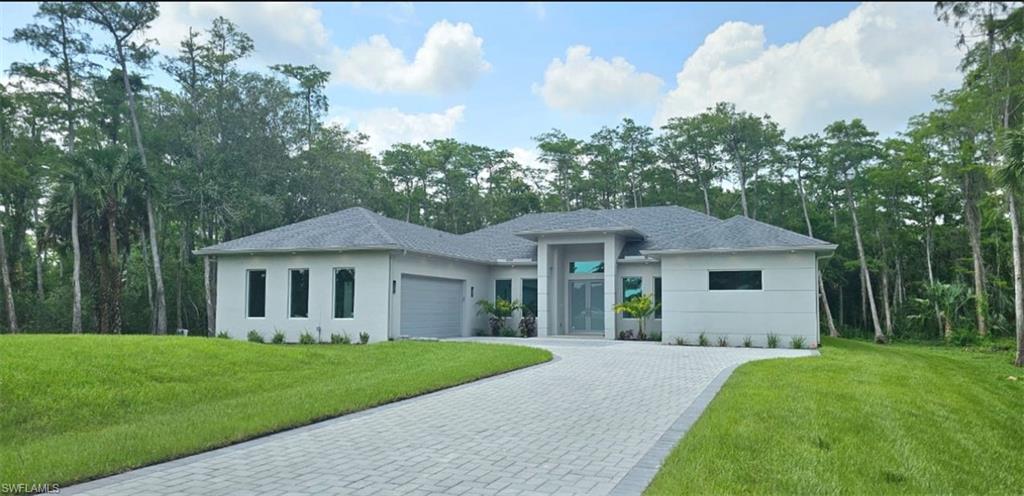 a view of a house with a yard