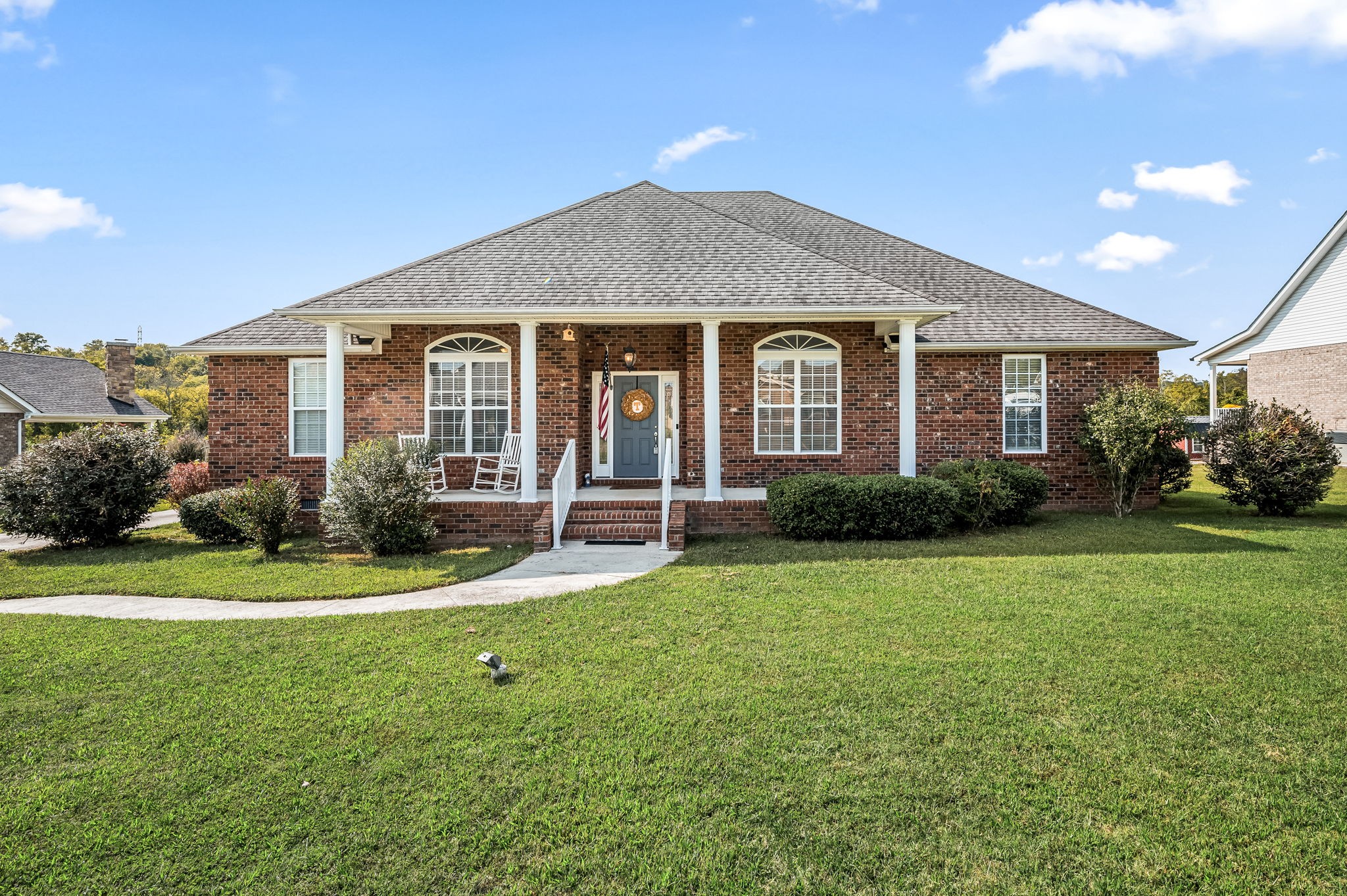 a front view of a house with a yard