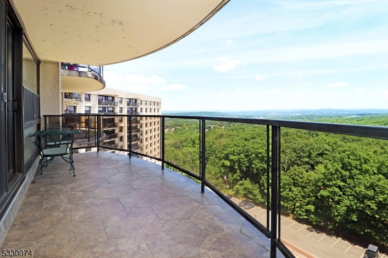 a view of balcony with furniture